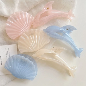 Jelly color shell and dolphin hair claw clips in soft pink, blue, and cream colors