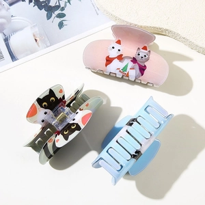 Three-piece set of cute cat hair claws featuring colorful cartoon kittens for women