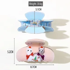 Cartoon cat hair claw clip set with dimensions 8.7cm x 5.2cm in pink and blue
