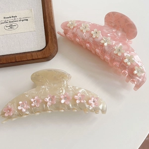 Pince à cheveux fleurie en acétate avec strass couleurs rose et blanc crème