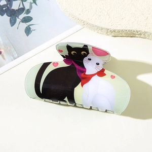 Cute cat claw clip made of acrylic with black and white kitten design for women hair