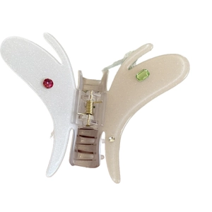 Pince à cheveux papillon blanche avec strass colorés et ressort doré élégant