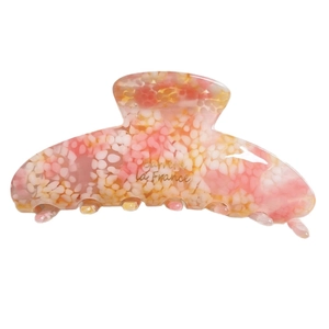 Elegant checkered acetate hair claw clip with pink and orange marble texture