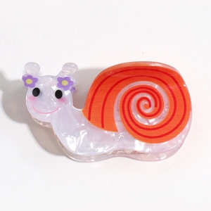Cute purple snail hair claw clip with orange shell and marble texture on white background