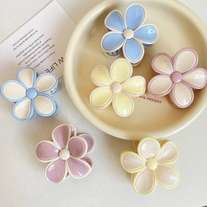 Elegant plumeria hair claw clips in pastel macaron colors with glossy finish
