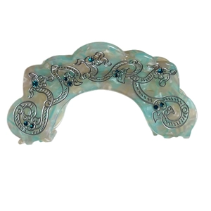Elegant marble acetate hair claw clip with silver metal accents and blue rhinestones
