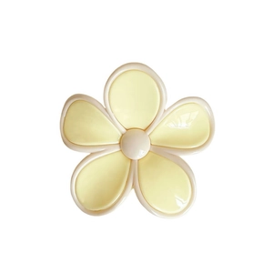 Elegant creamy yellow plumeria flower hair claw clip with a glossy finish for women