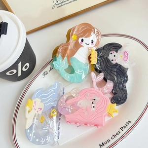 Set of four cute mermaid-shaped acetate hair claws in pastel colors for women