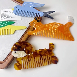 Cute acetate wide-tooth hair combs in various animal shapes with glossy marble patterns