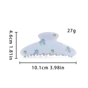 Detail view of acetate hair claw clip showing 10.1cm length and 4.6cm height dimensions
