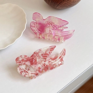 Elegant bird-shaped acetate hair claws with pink marble texture for women's hairstyling