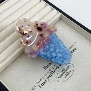 Detail of ice cream scoop hair claw made of premium acetate with marble texture