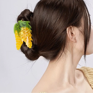 Vibrant corn-shaped acetate hair claw clip with green leaves and yellow kernels for women