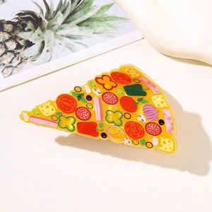 Macro detail of pizza hair claw clip showing realistic toppings and glossy finish textures