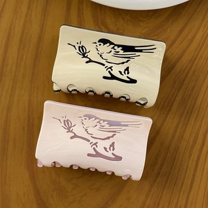 Acetate hair claw clips with creative bird print in cream white and cherry blossom pink
