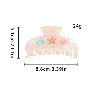 Pince à cheveux rose translucide avec relief d'étoile de mer et mesure de 8,6 cm