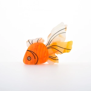 Detailed close-up of a goldfish hair claw clip with orange gradients and marble texture