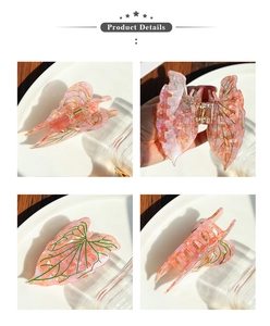 Detail view of pink acetic acid leaf hair claw clip with intricate green leaf veins