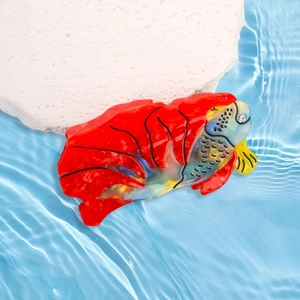 Elegant red goldfish hair claw clip made of premium acetate with textured ocean scales