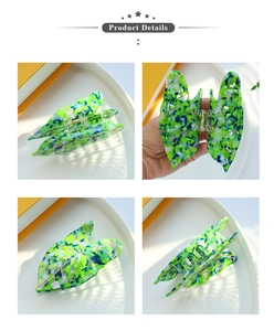Detail view of leaf-shaped acetate hair claw clip with colorful marble pattern
