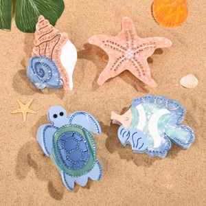 Pinces à cheveux en acétate sur le thème marin avec tortue et étoile de mer à strass