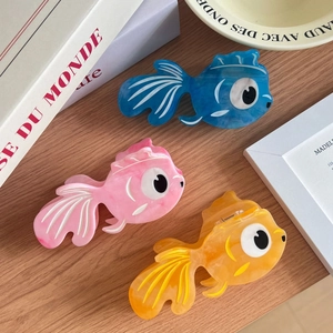 Chic acetate goldfish hair claws in blue pink and orange with marble textures