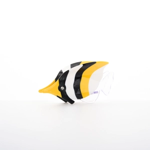 Macro detail of tropical fish hair claw featuring yellow black and white acetate stripes