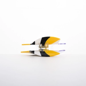 Detail view of tropical fish acetate hair claw clip with yellow and black stripe pattern