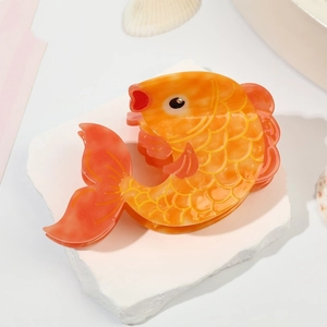 Elegant goldfish shaped acetate hair claw clip with orange gradient and fish scale texture
