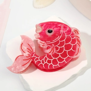 Elegant koi fish hair claw clip made of pink marble acetate with detailed scales