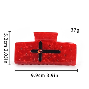Vue détaillée de la pince à cheveux araignée rouge avec croix en cristal et dimensions