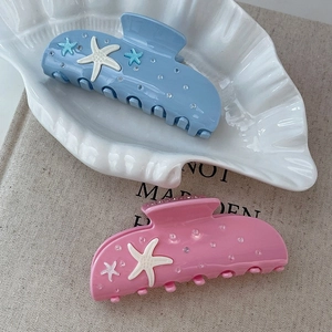 Elegantes pinzas para el cabello de estrella de mar en resina azul y rosa con cristales