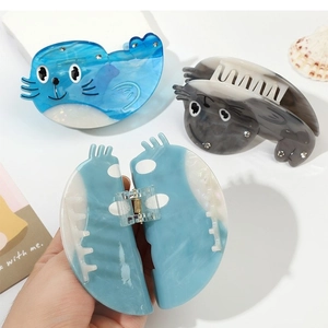 Süße Haarklammern in Robbenform aus Acetat, Blau und Grau marmoriert mit Glitzersteinen