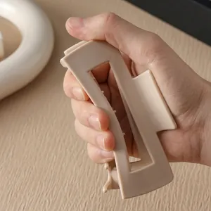 Flexible soft silicone shark hair claw clip in beige, durable and break-resistant