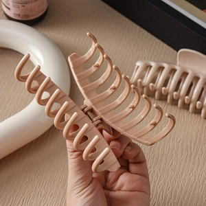 Large nude pink silicone shark hair clip with a matte finish and strong spring grip