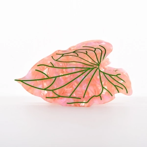 Pink acetate leaf-shaped hair claw clip with realistic green veins and marble texture