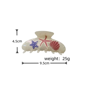 Detailed view of ocean-themed hair claw clip with starfish pattern and size specifications