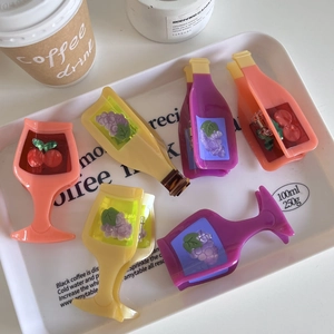 Creative wine bottle and glass shark hair clips in vibrant purple, yellow, and pink colors