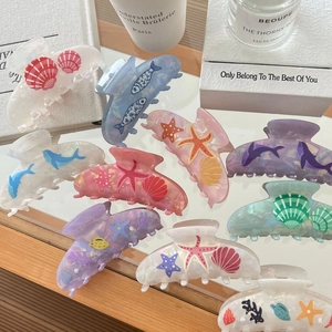 Marine series acetate hair claws featuring starfish and shell designs in soft pastel colors