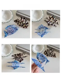 Detailed macro views of marble texture fish hair claws with premium metal spring mechanisms