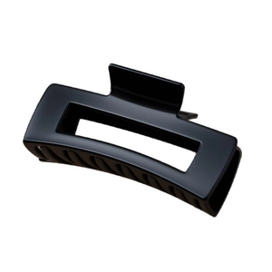 Glossy black rectangular silicone shark hair claw clip for women in 45-degree view