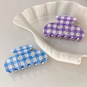 Elegant checkered flower hair claw clips in blue and purple with rhinestone accents