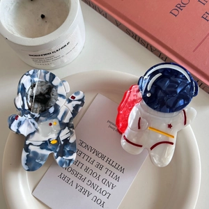 Set of two creative astronaut acetate hair claws with blue marble and white patterns