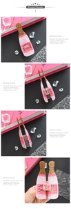 Detail showing pink marble champagne bottle hair claw with glitter and gold spring clip