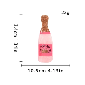 Detail view of 10.5cm pink champagne bottle hair claw clip with dimensions and 22g weight