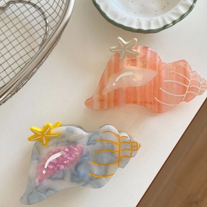 Seashell acetate hair claw clips with starfish accents in coral and marble grey colors