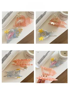 Detailed close-up showing seashell acetate hair claws with starfish accents and golden spring