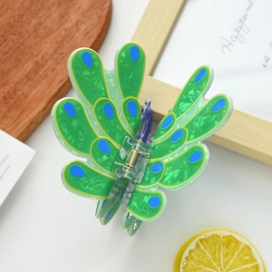 Exquisite peacock shaped hair claw clip in emerald green with blue rhinestone patterns