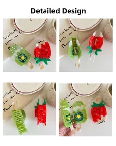 Detailed close-up showing acetate popsicle hair claws with fruit and chocolate patterns