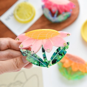 Pinza per capelli a girasole in acetato rosa e giallo con strass scintillanti